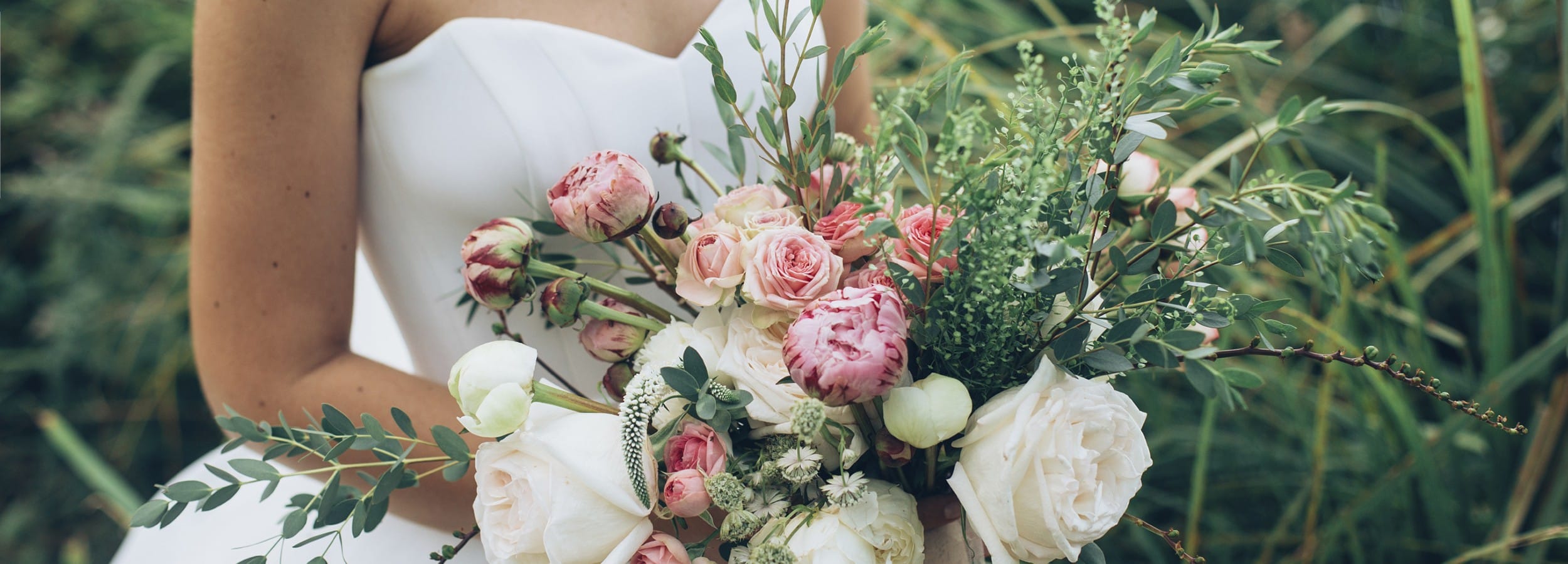 Picture of a bride holding a bouquet on the topic of timing in seeking marriage counseling