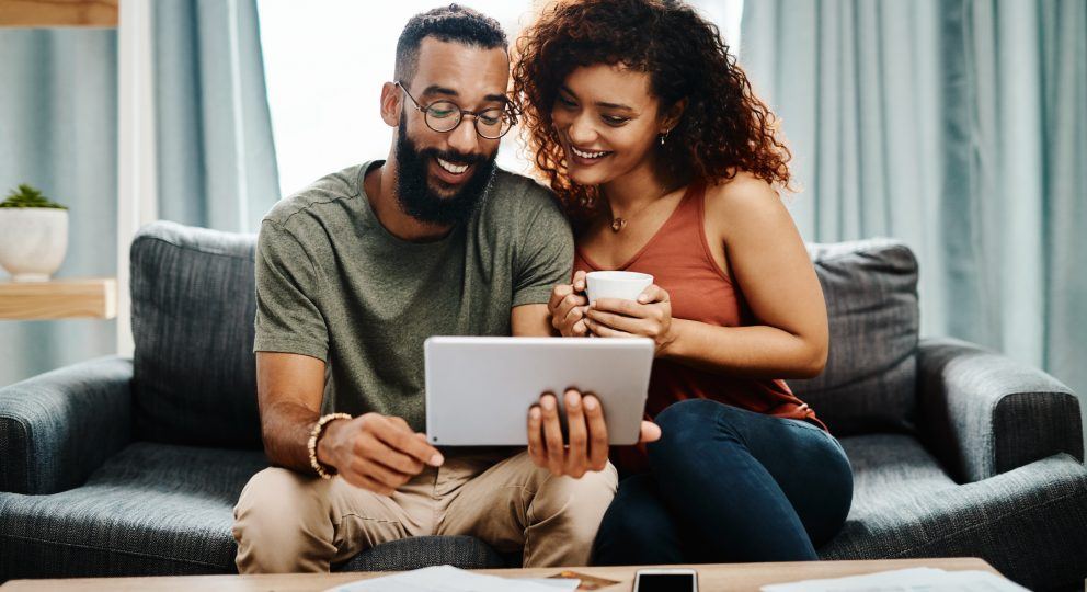 Young couple looking at computer screen together