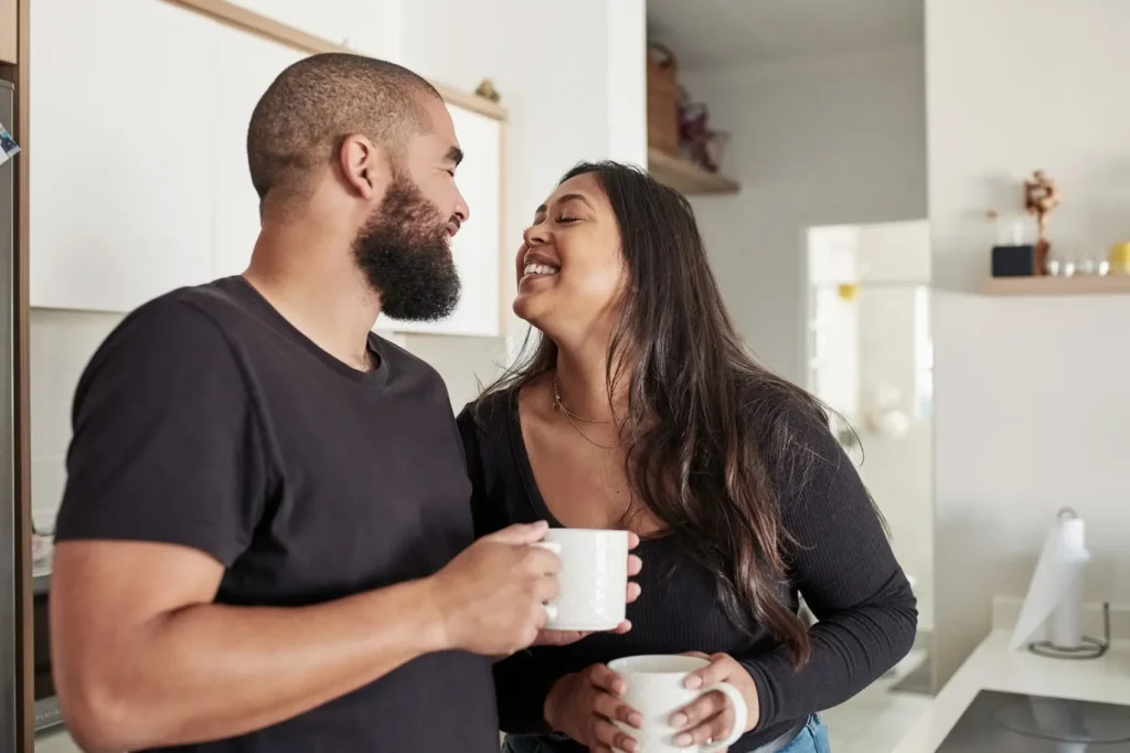 Couple happily connecting over coffee.