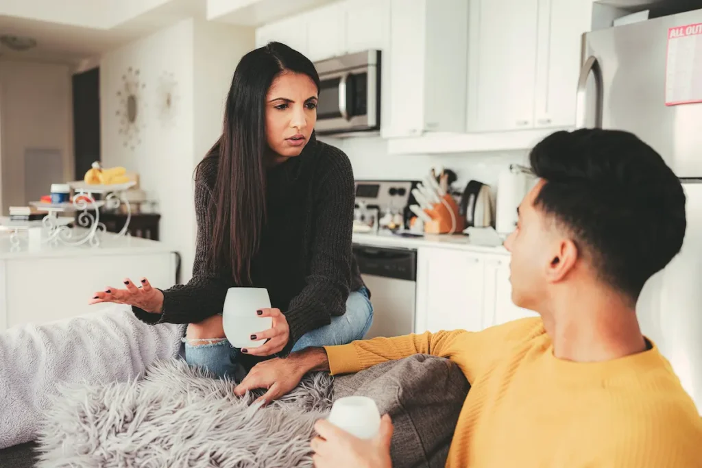 A young couple putting across their point of view and could be succumbing to common couples conflict mistakes that occur during conflict