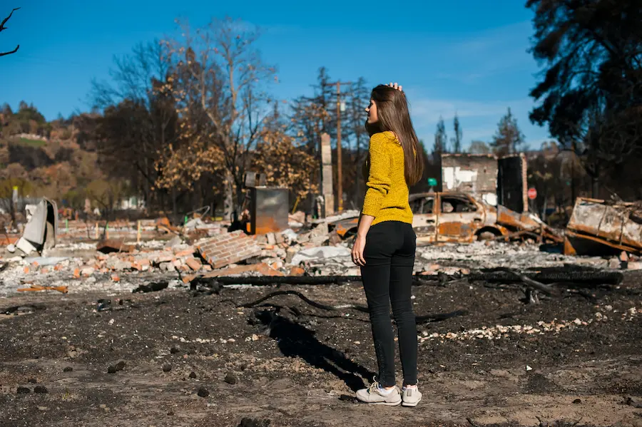 Woman dealing with the loss of her home destroyed in a fire.