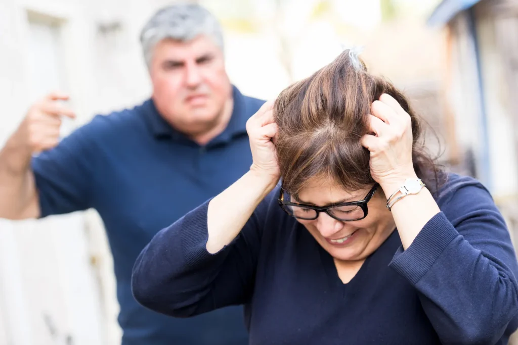 Woman in a toxic relationship with husband yelling at her